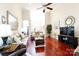 Open living room with hardwood floors, neutral decor, and ample natural light at 3617 Venetian Way, York, SC 29745