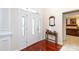 Bright entryway with hardwood floors, a console table, and a view into a bedroom at 3617 Venetian Way, York, SC 29745
