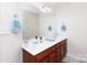 Double vanity bathroom with a large mirror and updated fixtures at 3617 Venetian Way, York, SC 29745