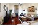 Spacious living room with hardwood floors, a stone fireplace, and comfortable seating at 3617 Venetian Way, York, SC 29745