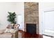 Stone fireplace with a decorative screen in the living room at 3617 Venetian Way, York, SC 29745