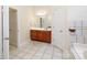 Well-appointed bathroom includes a vanity, tiled floors and a tub at 3617 Venetian Way, York, SC 29745