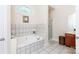 Bathroom with a soaking tub, shower, and updated tile at 3617 Venetian Way, York, SC 29745