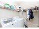 Convenient laundry room with washer, dryer, and shelving at 3617 Venetian Way, York, SC 29745