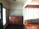 Living room featuring hardwood floors and built-in storage at 237 W 3Rd St, Kershaw, SC 29067