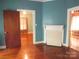 Bedroom with hardwood floors and fireplace at 237 W 3Rd St, Kershaw, SC 29067