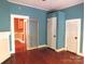 Bedroom with hardwood floors, closets and access to kitchen at 237 W 3Rd St, Kershaw, SC 29067