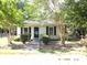 Yellow house with a classic front porch at 237 W 3Rd St, Kershaw, SC 29067