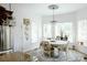 Bright dining area with a round table, chandelier, and bay windows at 4642 King Crowder Dr, Gastonia, NC 28052