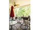 Covered back porch with ceiling fan, comfortable seating, and grill at 4642 King Crowder Dr, Gastonia, NC 28052