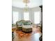Charming sitting room with a tufted sofa and ornate chandelier at 4642 King Crowder Dr, Gastonia, NC 28052