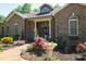 Brick ranch home with landscaped front yard and brick walkway at 4642 King Crowder Dr, Gastonia, NC 28052