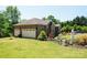 Brick home with a two-car garage and landscaped yard at 4642 King Crowder Dr, Gastonia, NC 28052