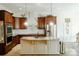 Large kitchen with granite countertops and dark wood cabinets at 4642 King Crowder Dr, Gastonia, NC 28052
