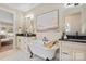 Spa-like bathroom with double vanity, freestanding tub, and hexagon tile at 4023 Randolph Rd, Charlotte, NC 28211