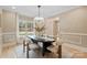 Bright dining room with modern oval table and seating for six at 4023 Randolph Rd, Charlotte, NC 28211
