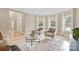 Spacious living room with two armchairs and a glass coffee table at 4023 Randolph Rd, Charlotte, NC 28211