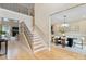 Two-story entryway with staircase and views to dining room and living room at 4023 Randolph Rd, Charlotte, NC 28211