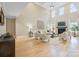 Two-story living room with hardwood floors, fireplace, and high ceilings at 4023 Randolph Rd, Charlotte, NC 28211