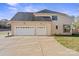 Rear view of house with two-car garage and driveway at 4023 Randolph Rd, Charlotte, NC 28211