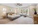 Main bedroom with sitting area and plenty of natural light at 4023 Randolph Rd, Charlotte, NC 28211