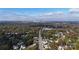 Long-range aerial view of homes and cityscape in the distance at 4023 Randolph Rd, Charlotte, NC 28211