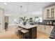 Spacious kitchen island with seating, open to the living area at 4023 Randolph Rd, Charlotte, NC 28211
