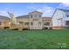 Two-story house with beige exterior and wooden deck at 4023 Randolph Rd, Charlotte, NC 28211