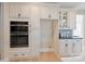 Well-equipped kitchen with double ovens and ample storage space at 4023 Randolph Rd, Charlotte, NC 28211