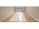 Light-filled bedroom with hardwood floors and window at 4023 Randolph Rd, Charlotte, NC 28211