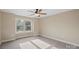 Charming bedroom with a large window and ceiling fan at 4023 Randolph Rd, Charlotte, NC 28211