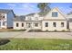 Two-story house with beige exterior and a front porch at 4023 Randolph Rd, Charlotte, NC 28211