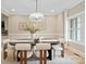 Elegant dining room featuring an oval table and six plush chairs at 4023 Randolph Rd, Charlotte, NC 28211
