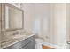 Powder room with granite vanity and updated fixtures at 4023 Randolph Rd, Charlotte, NC 28211