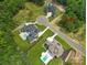 Aerial view of two luxury homes with pools on a wooded lot at 628 Wisteria Vines Trl # 6, Fort Mill, SC 29708