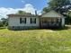 White single wide mobile home with covered porch at 100 Springs Ct, Stony Point, NC 28678