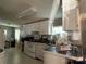Galley style kitchen with white cabinets and appliances at 100 Springs Ct, Stony Point, NC 28678