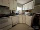 White cabinets and appliances in a small kitchen at 100 Springs Ct, Stony Point, NC 28678