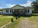 Ranch style home with covered porch and large yard at 100 Springs Ct, Stony Point, NC 28678
