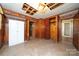 Needs renovation, bedroom with wood paneling and closets at 810 Hampton St, Shelby, NC 28152