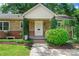 Inviting front porch with stone and brick exterior at 810 Hampton St, Shelby, NC 28152