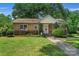 Brick ranch home with a well-manicured lawn and walkway at 810 Hampton St, Shelby, NC 28152