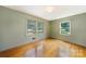 Light and airy bedroom with hardwood floors and two windows at 810 Hampton St, Shelby, NC 28152
