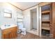 Bathroom with shower, toilet and shelving at 810 Hampton St, Shelby, NC 28152