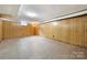 Large finished basement with tile floors and wood paneling at 810 Hampton St, Shelby, NC 28152