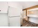 Kitchen with white refrigerator and wood flooring at 810 Hampton St, Shelby, NC 28152