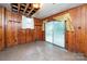 Unfinished basement room with wood paneling and sliding door at 810 Hampton St, Shelby, NC 28152