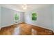 Bright bedroom with hardwood floors and ceiling fan at 810 Hampton St, Shelby, NC 28152