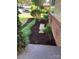 Landscaped front yard with mulch beds and a stone bench at 810 Hampton St, Shelby, NC 28152
