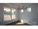 Bright dining room with wainscoting and chandelier at 15500 Nc Hwy 73 Hwy, Huntersville, NC 28078